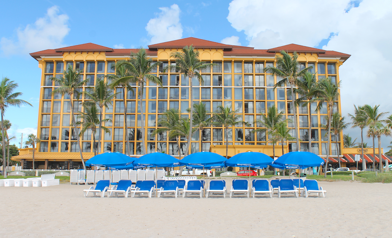 Wyndham Deerfield Beach Resort beach facade with loungers