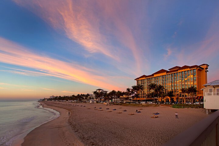 Sunset over the beach with the Wyndham resort in the background